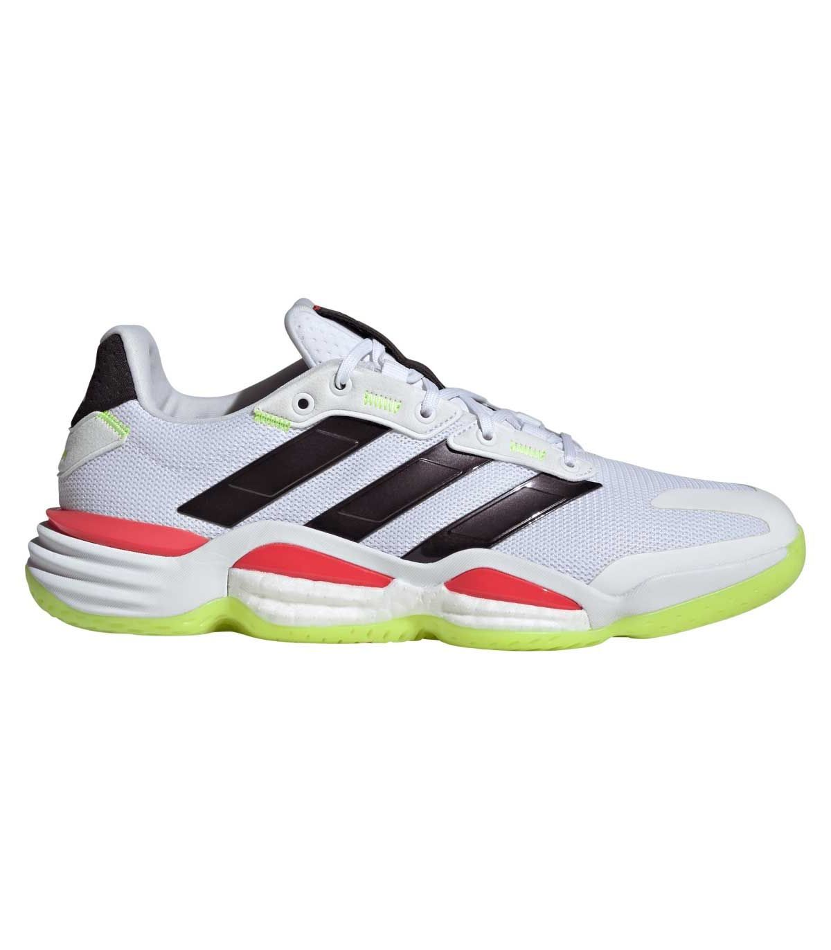 Zapatillas Adidas Stabil 16 Indoor blancas con tecnología BOOST para estabilidad y potencia en pistas cubiertas.
